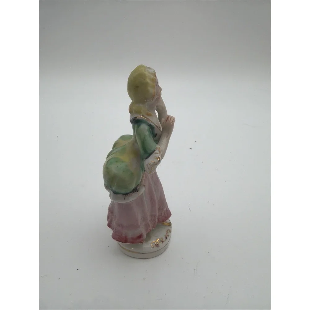 vintage hand-painted porcelain colonial or Victorian lady figurine